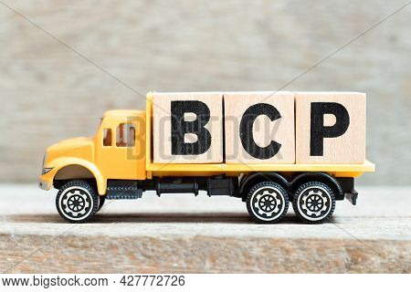 Toy Truck Hold Alphabet Letter Block In Word Bcp (abbreviation Business Continuity Plan) On Wood Bac
