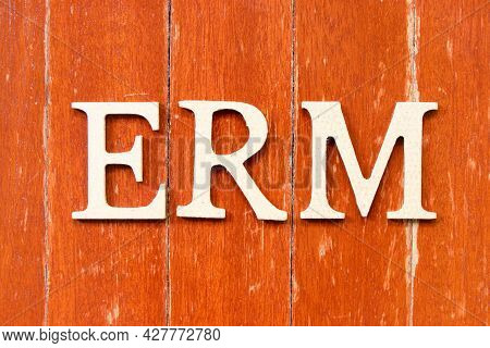 Alphabet Letter In Word Erm (abbreviation Of Enterprise Risk Management) On Old Red Color Wood Plate