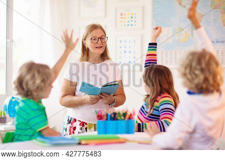 Kids In School. Preschool Children In Class. Happy Kids Back To School. Student In Classroom. Child 