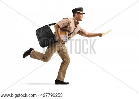 Full length profile shot of a mailman running and carrying letters isolated on white background
