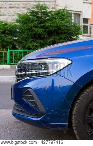 Moscow, Russia - July 2021: Front Part Of Blue Car Volkswagen Polo Sixth Generation In The City Stre