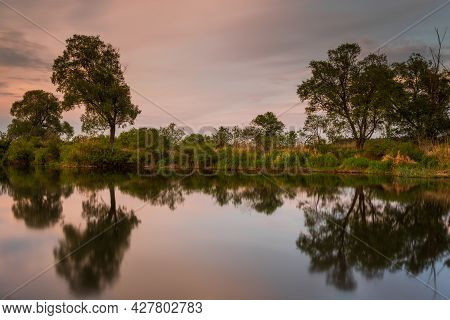 Sunset Over Warta River In Warta Landscape Park, Lad, Poland.