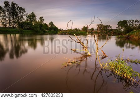 Sunset Over Warta River In Warta Landscape Park, Lad, Poland.