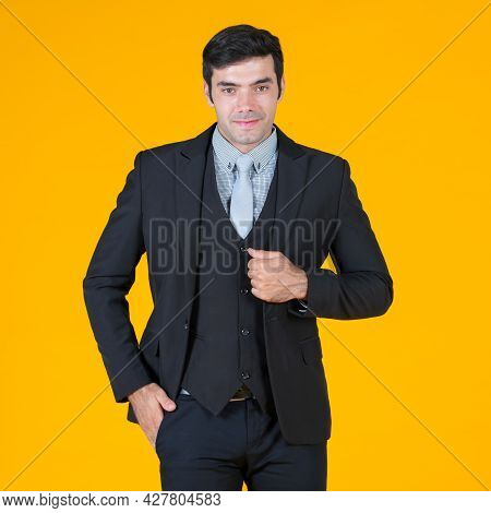 Caucasian Businessman In Gray Shirt And Black Suit, Put His Hand In The Pocket Pant And Smiling Humb