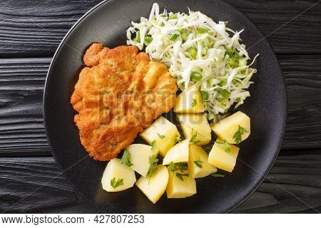 Polish Breaded Pork Cutlets Kotlet Schabowy With Boiled Potatoes And Cabbage Salad Close-up In A Pla