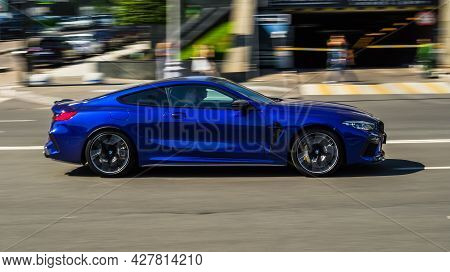 Moscow, Russia - July 2021: Bmw 8 Series On The Road In Motion. Fast Speed Drive On City Road. Side 