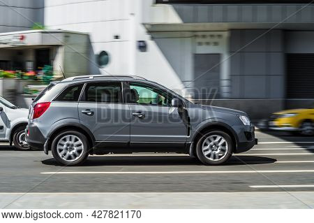 Moscow, Russia - July 2021: Opel Antara On Asphalt Road In Summer Day In Blurred Urban Landscape. Th