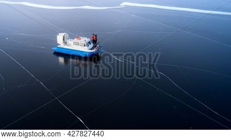 Coast Guard. Rescuers On Board A Hovercraft Among The Ice. Shooting From A Drone. Copy Space.