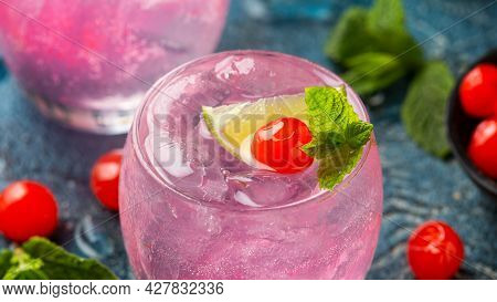 Cherry Limeade Or Lemonade In Drinking Glass. Refreshing Summer Drink.