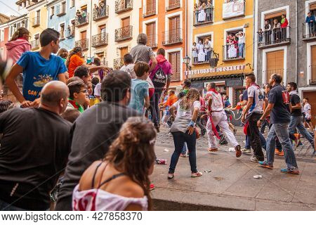 Cuenca, Spain - September 18, 2015: People running with bull on Plaza Mayor in Cuenca during The San Mateo fiesta