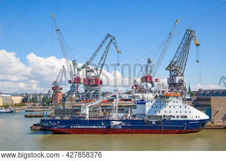 Helsinki, Finland - July 26, 2017:  Cargo port in Helsinki with cranes and ship
