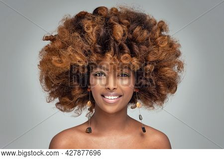 Beauty Portrait Of Happy Afro American Woman With Culry Hairstyle And Glamour Colorful Makeup.