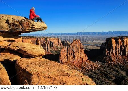 Hiker Injoying The View Of  Monument Canyon, Colorado National Monument, Grand Junction, Usa