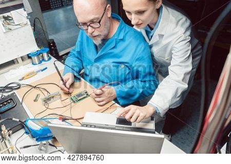 Team of development engineers designing new product in the lab