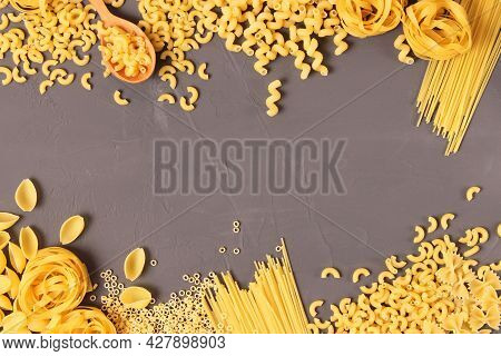 Different Types Of Pasta Close-up On A Colored Background.