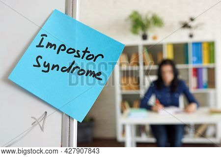 Impostor Syndrome Written On The Sticker On The Whiteboard.