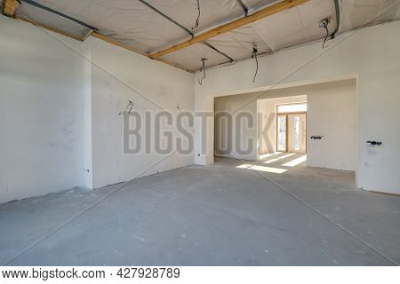 Empty Unfurnished Room With Minimal Preparatory Repairs. Interior With White Walls And Drywall