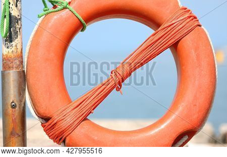 Big Orange Lifebuoy As A Rope For The Rescue Of Any Swimmers In The Sea