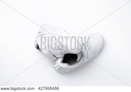 Top View Set Of White Unisex Sneakers Symbol Of Healthy Sports Habits And Health Isolated On A White