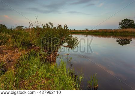Sunset Over Warta River In Warta Landscape Park, Lad, Poland.