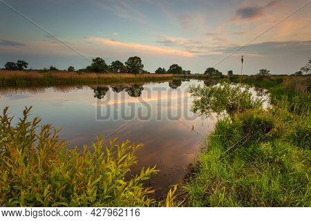 Sunset Over Warta River In Warta Landscape Park, Lad, Poland.
