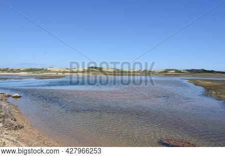 Stunning Sand Dunes Along Tidal Marsh On Cape Cod.