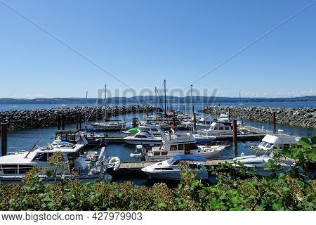 Powell River, British Columbia, Canada - July 5th, 2021: A Marina With Docks Full Of Boats On A Beau
