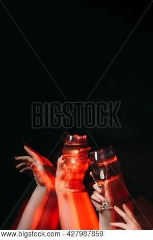 Birthday Party. Friends Celebration. Holiday Fun. Festive Overdrink. Female Hands Holding Glasses Of