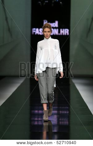 ZAGREB, CROATIA - OCTOBER 19: Fashion model wearing clothes designed by Pavla Aleksic on the 'Fashion.hr' show on October 19, 2013 in Zagreb, Croatia.