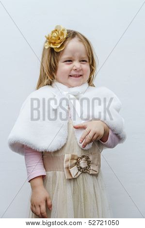 Cute Little Girl Trying On Dress