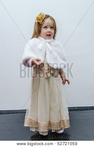 Cute Little Girl Trying On Dress