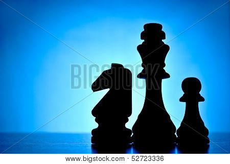 Three Silhouetted Chess Pieces