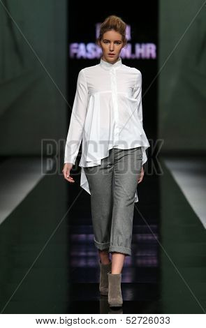 ZAGREB, CROATIA - OCTOBER 19: Fashion model wearing clothes designed by Pavla Aleksic on the 'Fashion.hr' show on October 19, 2013 in Zagreb, Croatia.