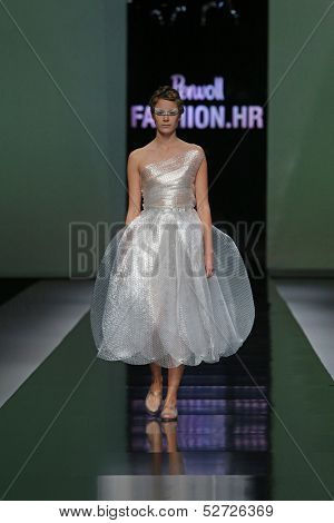 ZAGREB, CROATIA - OCTOBER 19: Fashion model wearing clothes designed by Branka Donassy on the 'Fashion.hr' show on October 19, 2013 in Zagreb, Croatia.
