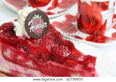Raspberry cake with red coffee cups