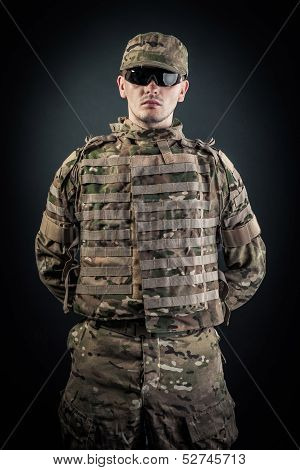Military Man On A Black Background