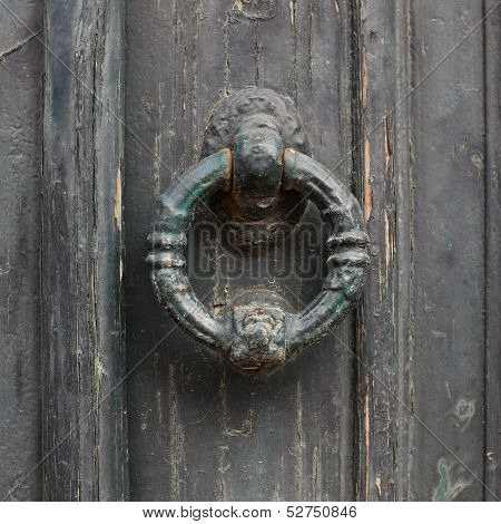 Old Doorhandle On Green Wooden Door