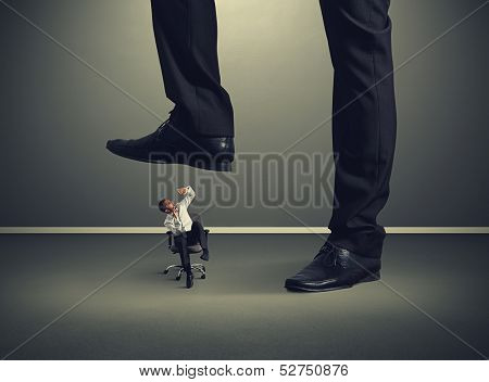 scared small man under big leg