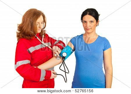Paramedic Checking Blood Pressure
