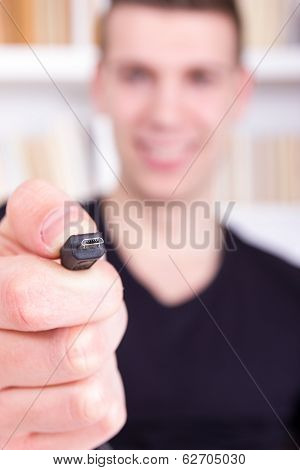Man Holding And Showing Black Micro Usb Cable