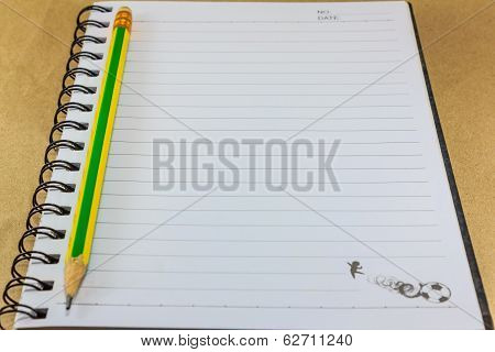 Notepad On Wooden Table