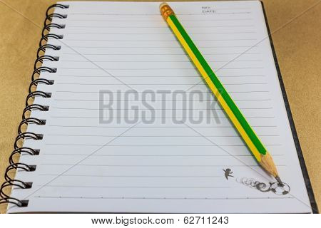 Notepad On Wooden Table