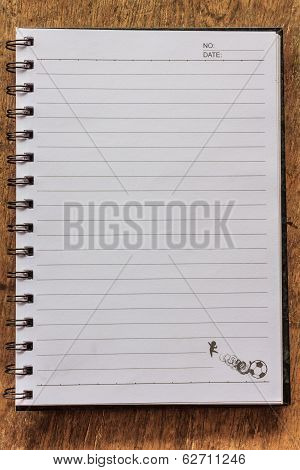 Notepad On Wooden Table