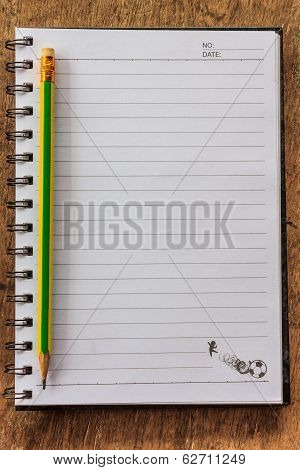 Notepad On Wooden Table