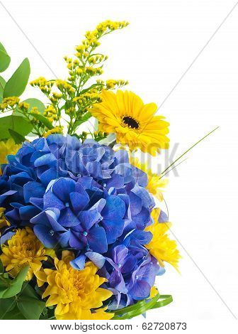 Bouquet from blue hydrangeas and yellow asters, a flower background