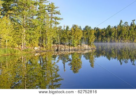 Mist And Reflections In The Early Morning