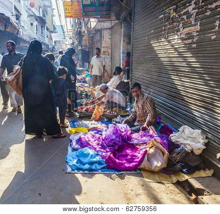 Man Sells Fruits At The Vegetable Street Market In Delhi