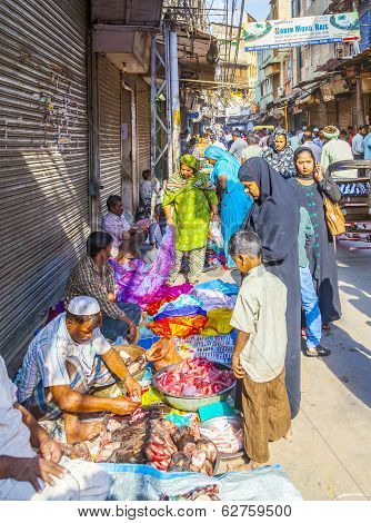 Man Sells Fruits At The Vegetable Street Market In Delhi