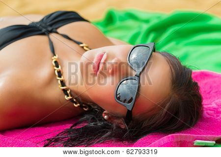 Woman On Beach Gets Sun Tan