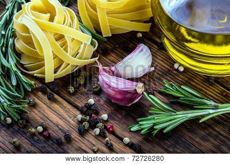 Mediterranean cuisine Pasta tagliatelle penne pepper thyme garlic cherry tomatoes and olive oil.